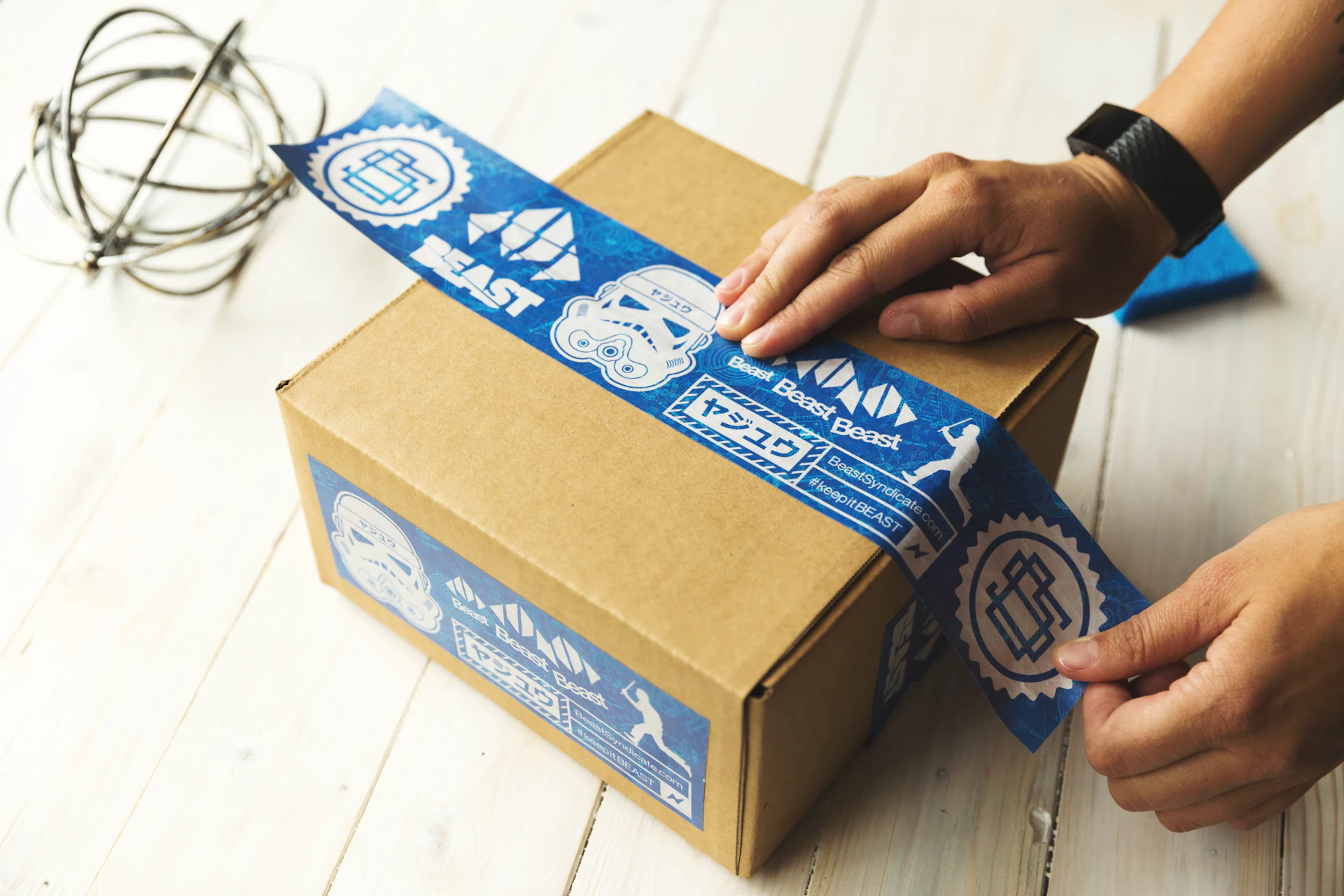 A seller taping up a parcel ready to ship
